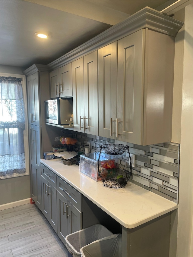 113-21 203rd St, Saint Albans, NY 11412 - kitchen featuring gray cabinetry, tasteful backsplash, light countertops, and recessed lighting