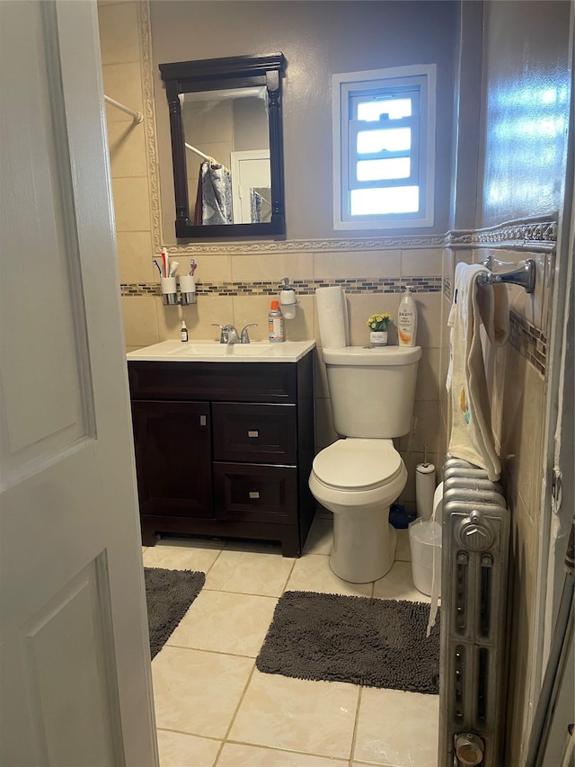 113-21 203rd St, Saint Albans, NY 11412 - bathroom featuring tile patterned floors, vanity, tile walls, and toilet