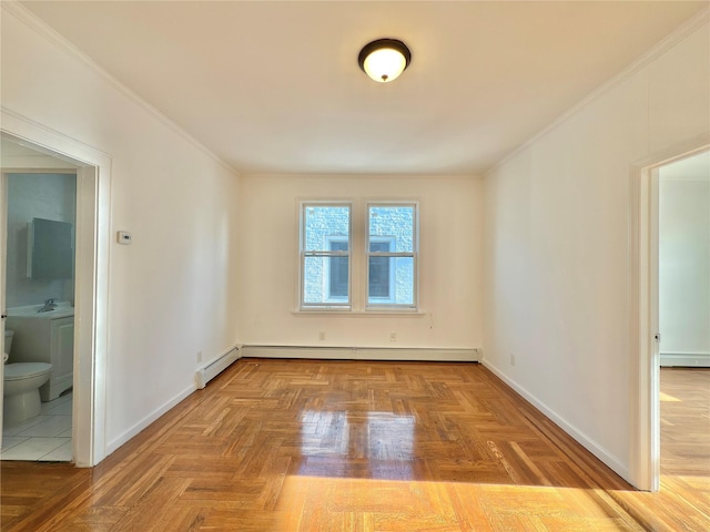 unfurnished room with crown molding, baseboard heating, and baseboards