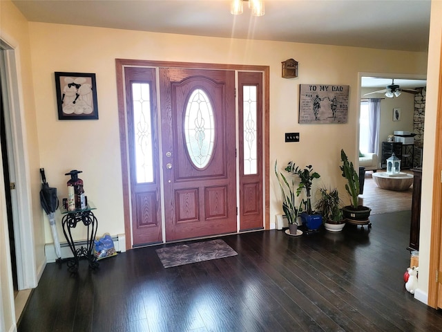 entryway with a ceiling fan, wood finished floors, baseboard heating, and a baseboard radiator