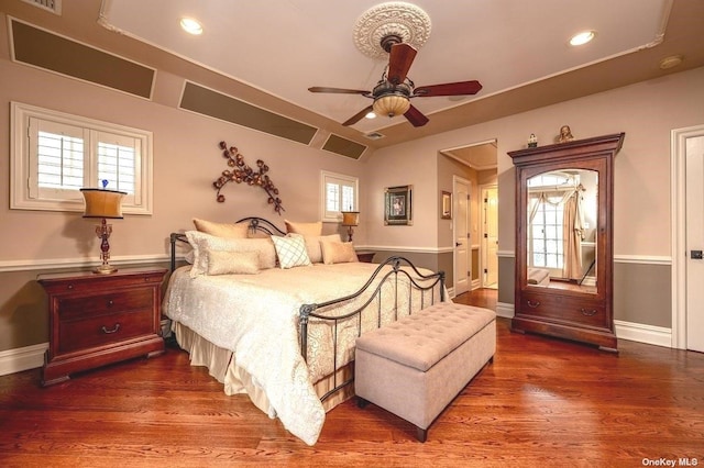 bedroom with recessed lighting, wood finished floors, a ceiling fan, and baseboards