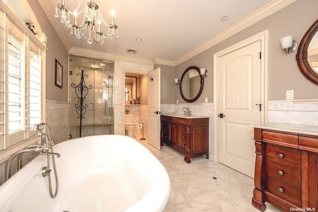 bathroom with a stall shower, a wainscoted wall, marble finish floor, crown molding, and a freestanding tub