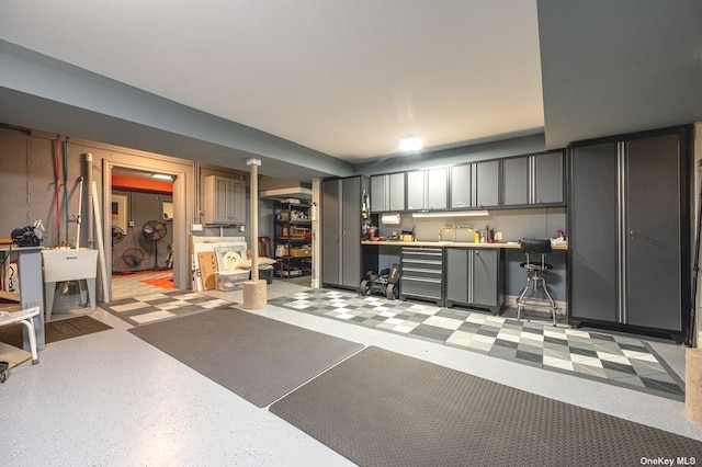 interior space with beverage cooler and a sink