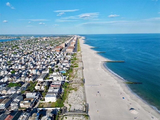 aerial view with a water view and a view of the beach