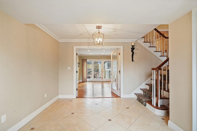 entryway with ornamental molding, light tile patterned flooring, and stairs