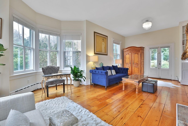 20 Stevenson St, Piermont, NY 10968 - living area with plenty of natural light, hardwood / wood-style floors, and a baseboard radiator
