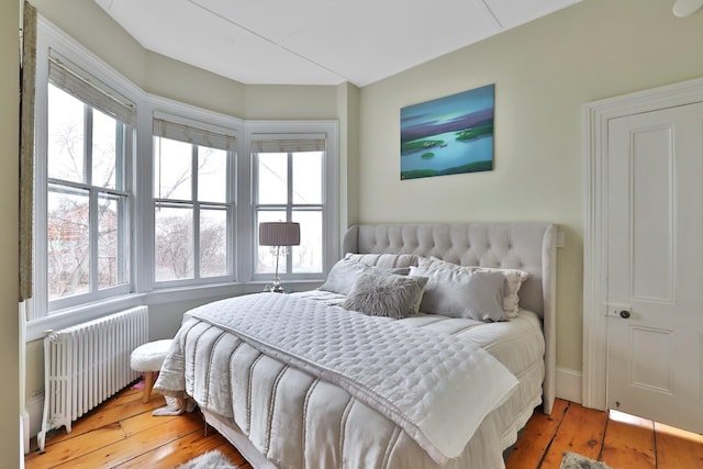 20 Stevenson St, Piermont, NY 10968 - bedroom featuring radiator heating unit, hardwood / wood-style floors, and multiple windows