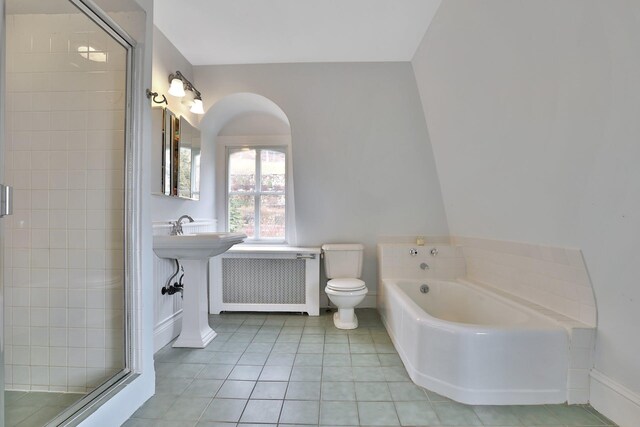 20 Stevenson St, Piermont, NY 10968 - bathroom with radiator heating unit, a shower stall, tile patterned flooring, and a bath