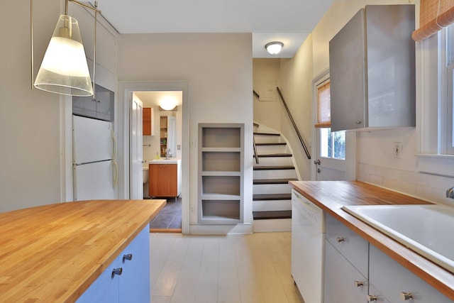 20 Stevenson St, Piermont, NY 10968 - kitchen featuring white appliances, wood counters, a sink, light wood-type flooring, and backsplash