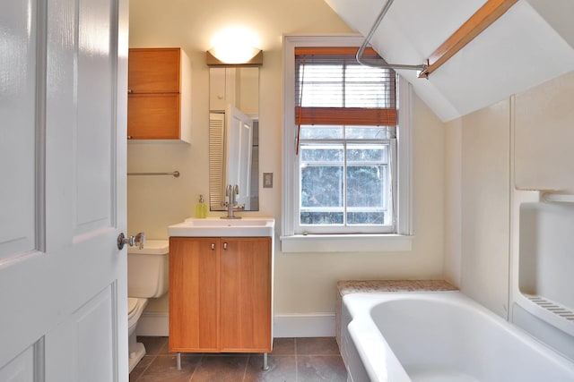 20 Stevenson St, Piermont, NY 10968 - bathroom with toilet, a bathtub, vaulted ceiling, tile patterned floors, and vanity