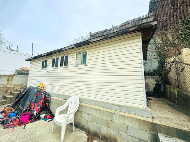 view of side of property with fence