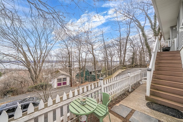 view of patio / terrace featuring stairway and a fenced front yard