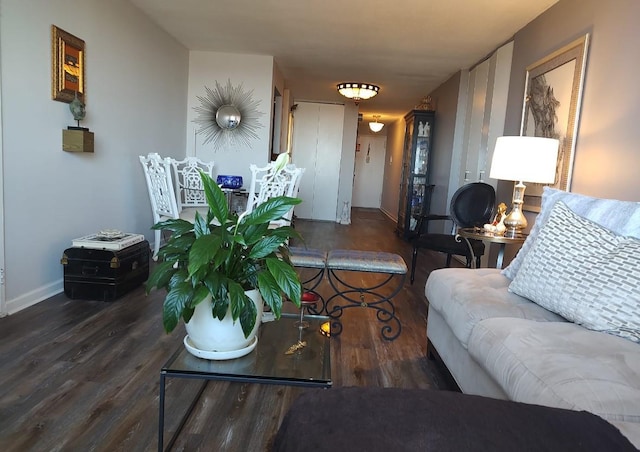 living room featuring baseboards and wood finished floors