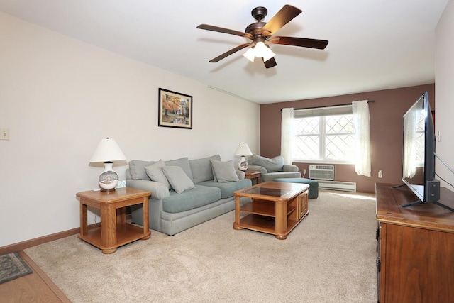 living area featuring a wall unit AC, ceiling fan, baseboards, and baseboard heating