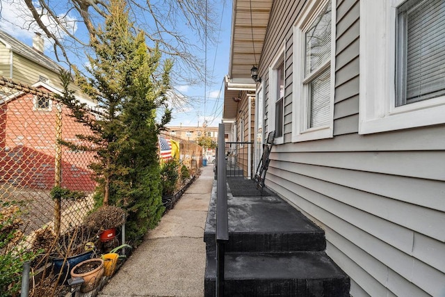 view of property exterior featuring fence