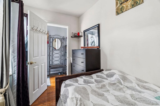 bedroom featuring wood finished floors