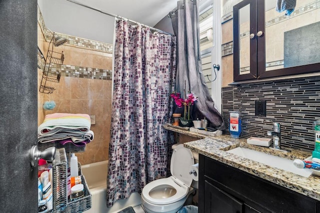 bathroom with shower / tub combo, vanity, toilet, and decorative backsplash
