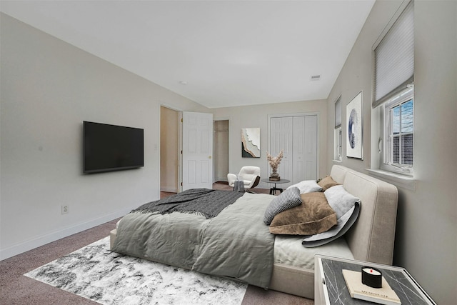 bedroom featuring carpet floors, a closet, visible vents, and baseboards