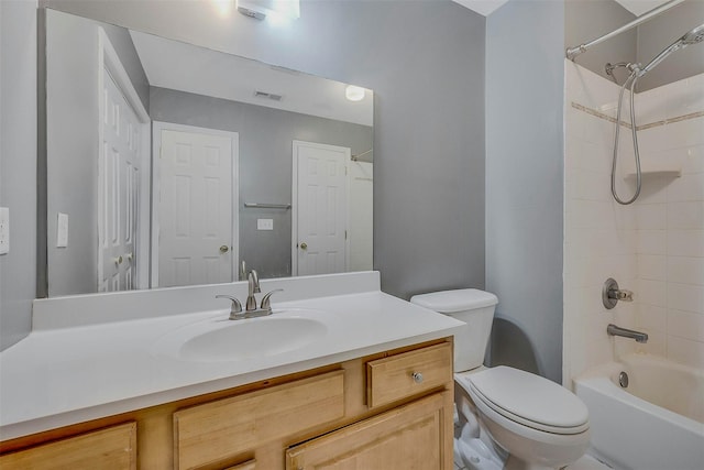 bathroom with shower / washtub combination, visible vents, vanity, and toilet