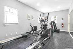 workout area featuring baseboards