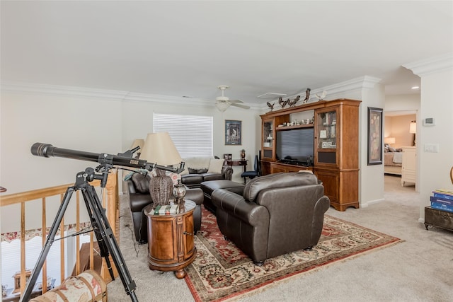 living area with plenty of natural light, light colored carpet, a ceiling fan, and crown molding