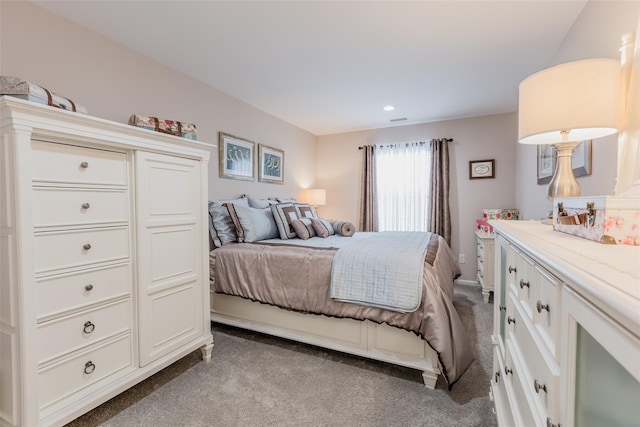 bedroom with carpet floors and recessed lighting