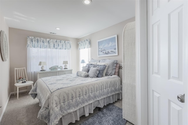 carpeted bedroom featuring visible vents and recessed lighting