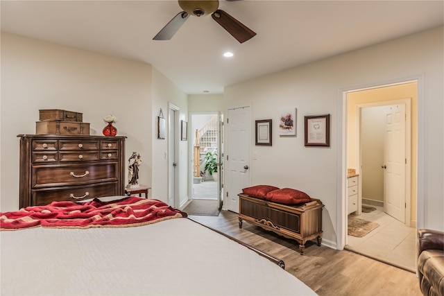 bedroom featuring light wood finished floors, recessed lighting, connected bathroom, ceiling fan, and baseboards