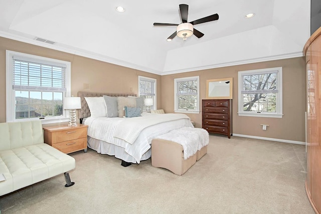 bedroom with light carpet, multiple windows, visible vents, and a raised ceiling