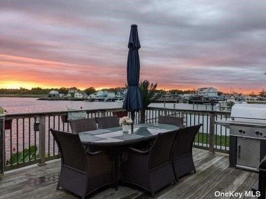 deck featuring outdoor dining area