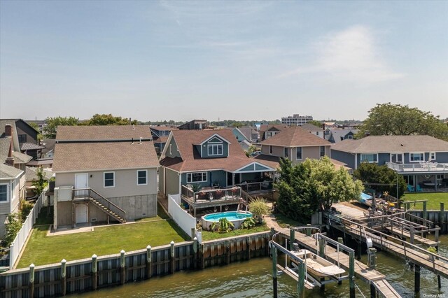 exterior space featuring a water view and a residential view