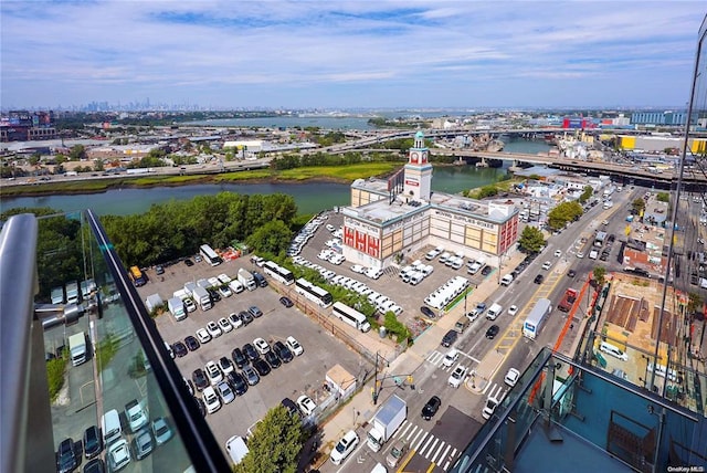 drone / aerial view featuring a view of city and a water view