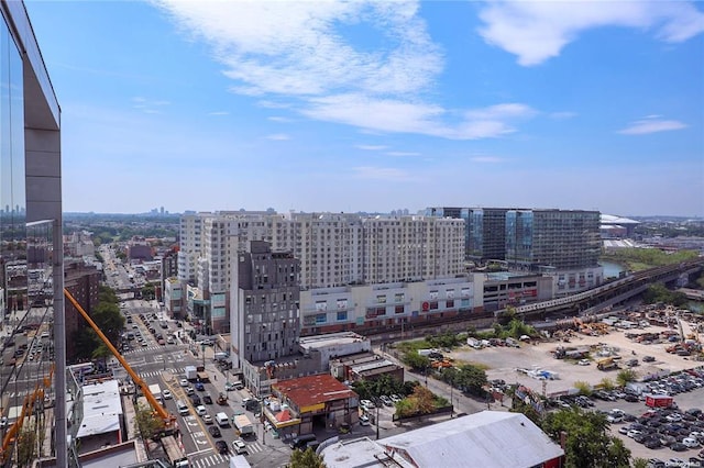 birds eye view of property with a view of city