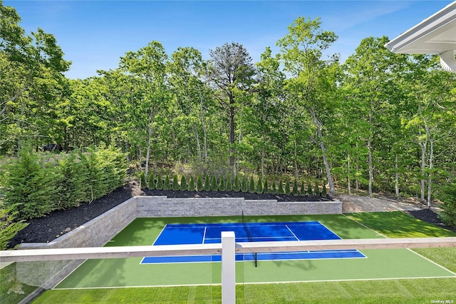 exterior space featuring basketball hoop