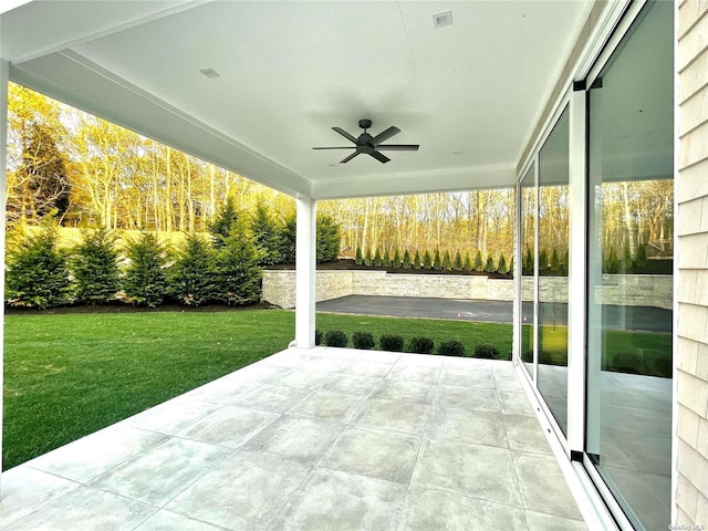 view of patio featuring a ceiling fan and visible vents