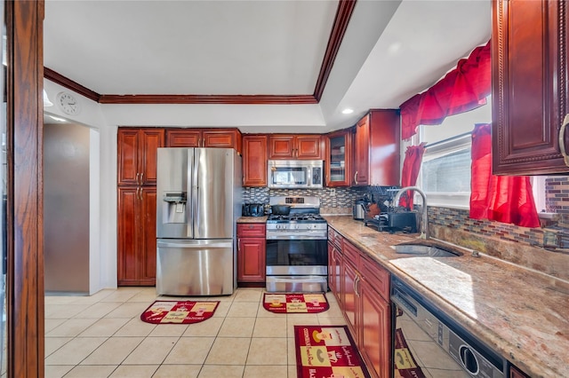 kitchen with crown molding, appliances with stainless steel finishes, and dark brown cabinets