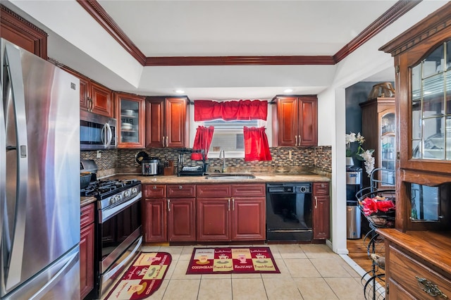 kitchen featuring light tile patterned floors, appliances with stainless steel finishes, crown molding, dark brown cabinets, and a sink