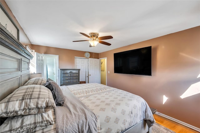 bedroom with ceiling fan and wood finished floors