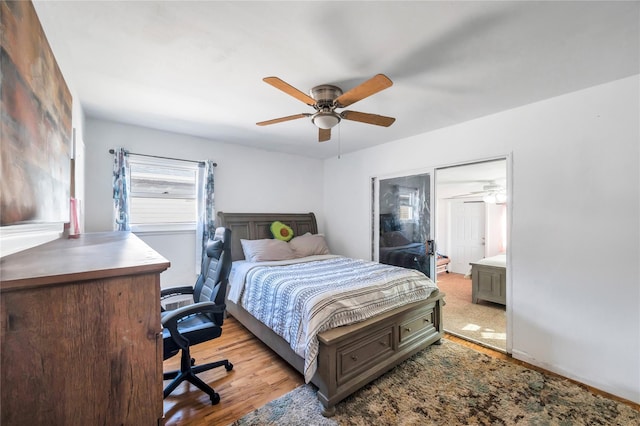 bedroom with wood finished floors and a ceiling fan