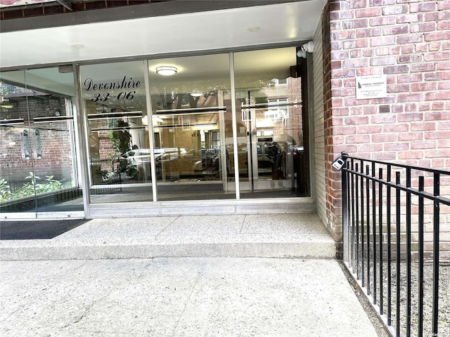 entrance to property with brick siding