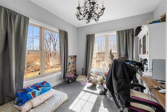 office area with a wealth of natural light, a chandelier, and baseboards