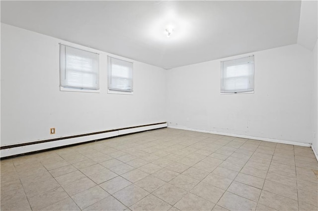 unfurnished room featuring lofted ceiling, baseboards, and baseboard heating