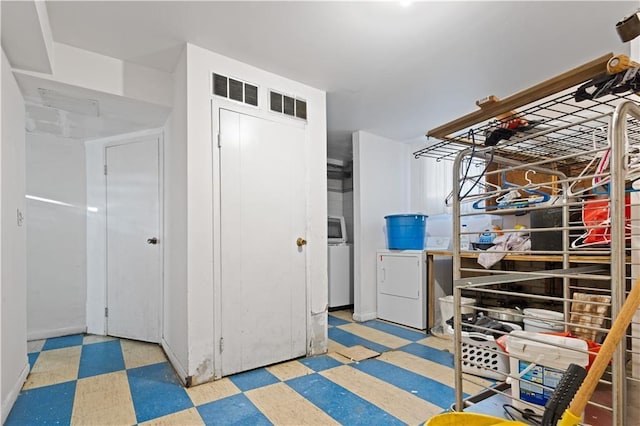 interior space featuring visible vents and washer and clothes dryer