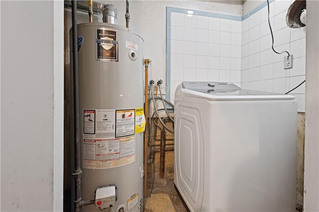 utility room featuring washer / dryer and water heater