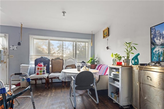 dining space featuring wood finished floors