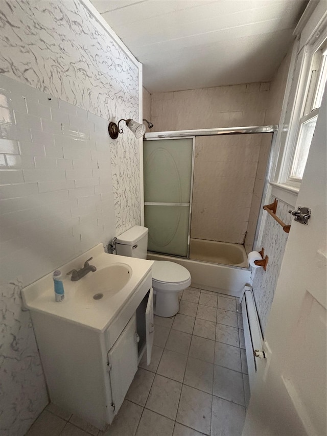 bathroom with toilet, bathing tub / shower combination, vanity, and tile patterned floors