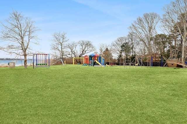 view of yard featuring a water view and playground community