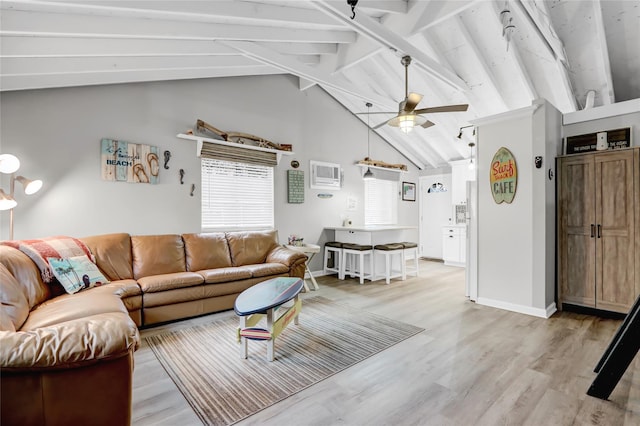 living room featuring baseboards, ceiling fan, beamed ceiling, light wood-style floors, and high vaulted ceiling