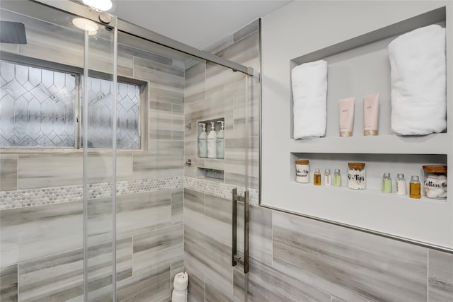 bathroom with a shower stall