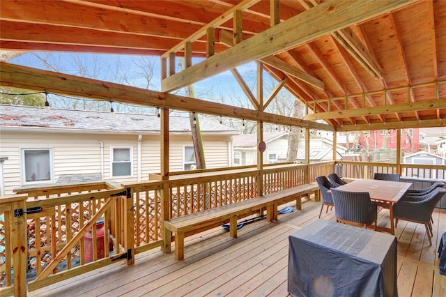 wooden deck featuring outdoor dining area